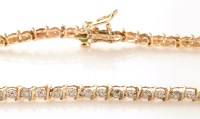 Lot 777 - A diamond line bracelet, each link set with a...