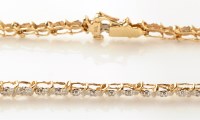 Lot 778 - A diamond line bracelet, each link set with...