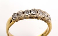 Lot 780 - A seven stone diamond ring, the brilliant cut...