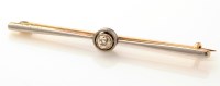 Lot 785 - A diamond and gold bar brooch, the central old...