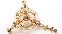 Lot 787 - An Edwardian sapphire, seed pearl and yellow...