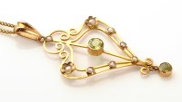 Lot 788 - An Edwardian peridot, seed pearl and yellow...