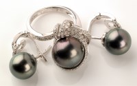 Lot 796 - A black cultured pearl and diamond ring, the...