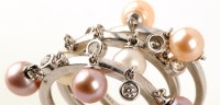 Lot 797 - A suite of three cultured pearl and diamond...