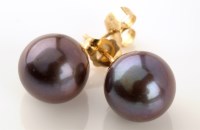 Lot 808 - A pair of black cultured pearl ear studs, each...