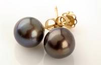 Lot 811 - A pair of black cultured pearl ear studs, each...