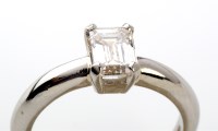 Lot 823 - A single stone diamond ring, the emerald cut...