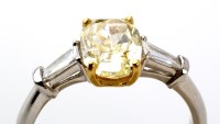 Lot 824 - **WITHDRAWN** A natural fancy yellow diamond...