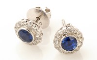 Lot 827 - A pair of sapphire and diamond cluster stud...