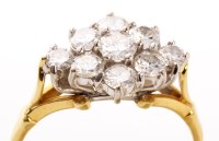 Lot 830 - A nine stone diamond ring, the brilliant cut...