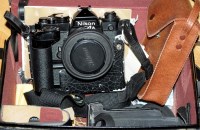 Lot 973 - A Nikon FE 35mm SLR camera, with a Nikkor 50mm...