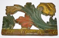 Lot 974 - A section of carved and painted wood, bearing...