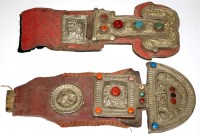 Lot 1011 - Two Tibetan belt ornaments, each with leather...