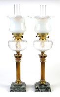 Lot 1029 - A pair of 19th Century table oil lamps, each...