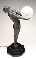 Lot 1037 - A patinated bronze Art Deco style table lamp,...