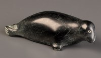 Lot 1038 - Mark Ilisituk (b.1902): a carved soapstone sea...