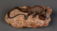 Lot 1041 - A cast patinated bronze lizard, mounted on a...