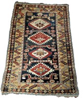 Lot 1091 - A mid 20th Century Kazak rug, with bold...