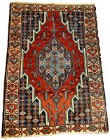 Lot 1094 - A mid 20th Century Kazak rug, of stylized...