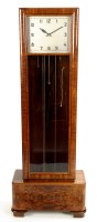 Lot 1128 - A 1930's Art Deco style walnut longcase clock,...