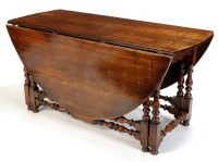 Lot 1154 - A large 17th Century style oak drop-leaf...