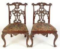 Lot 1177 - A set of four ornate Chippendale style...