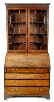 Lot 1214 - A George III mahogany bureau bookcase, the...