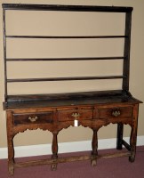 Lot 1215 - A mid 18th Century oak dresser, with raised...