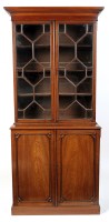 Lot 1227 - A George III mahogany bookcase, with a flared...