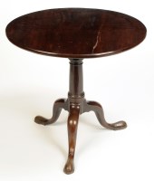 Lot 1235 - A George III mahogany circular tip-up-top...