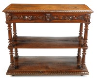 Lot 1272 - A Victorian carved oak three-tier buffet, with...