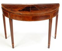 Lot 1277 - A George III semi circular card table, with...