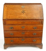 Lot 1278 - A George III oak bureau with a rectangular...