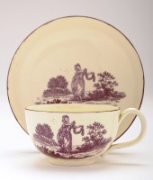 Lot 42 - Creamware puce transfer printed cup and saucer,...