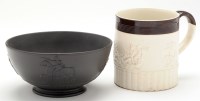 Lot 118 - Black basalt bowl, with military trophy and...