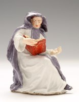 Lot 142 - Bow figure of an abbess, seated wearing...