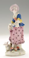 Lot 144 - Bow figure of a dancing shepherdess, holding...