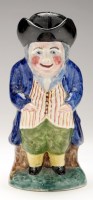 Lot 267 - Toby character jug and cover, in slouching...
