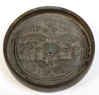 Lot 327 - Japanese bronze mirror, the back cast with...