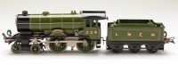 Lot 511 - A clockwork locomotive and tender, by Hornby,...