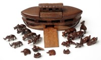 Lot 523 - An African rosewood Noah's ark and animals,...