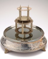 Lot 543 - An electroplated cake stand, the mirrored top...