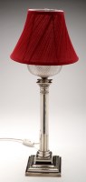 Lot 548 - An EPNS column form table lamp, converted from...