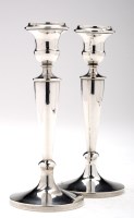 Lot 564 - A pair of George V candlesticks, by Charles S....