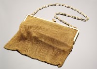 Lot 676 - A 9ct. yellow gold chain mail purse, by R.C.,...