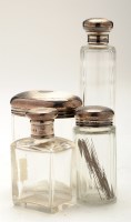 Lot 684 - Four cut glass dressing table jars with silver...