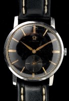 Lot 765 - Omega: a steel cased wristwatch, the black...