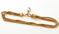 Lot 833 - A French gold bracelet, made up of three rows...