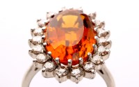 Lot 839 - A citrine and diamond cluster ring, the...