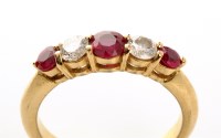 Lot 841 - A red stone and diamond ring, the tapering...